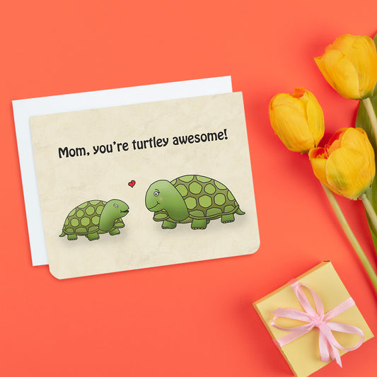 A photo of a mothers day card. It has a small turtle saying to a big turtle, 'Mom, You're turtley awesome!