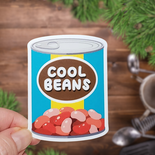 A photo of a fun sticker. It's an illustration of a can of beans. Text on the can label says 'Cool Beans.'