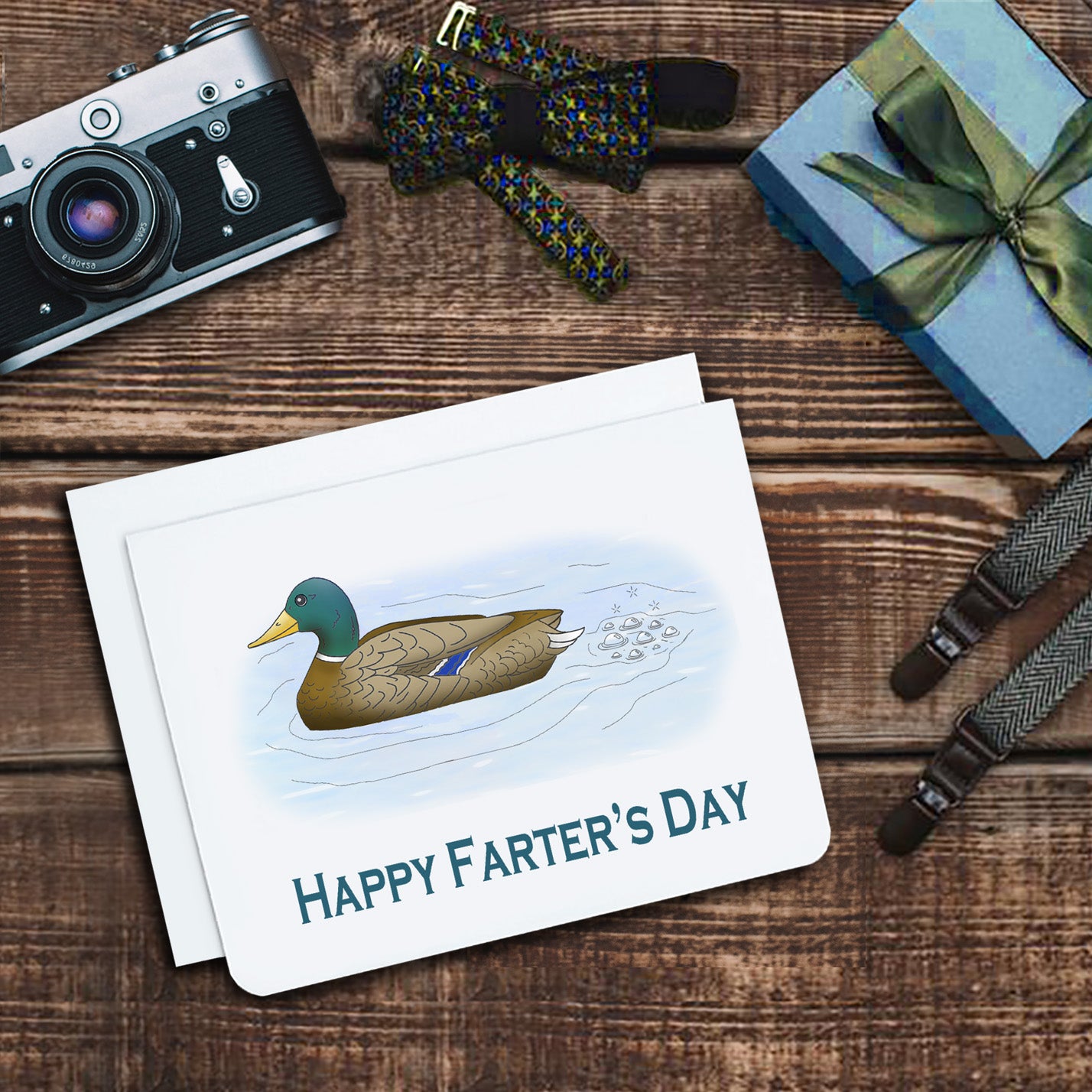 a fathers day card. It has a mallard duck in water with bubbles behind it. Text reads, 'Happy Farter's Day'