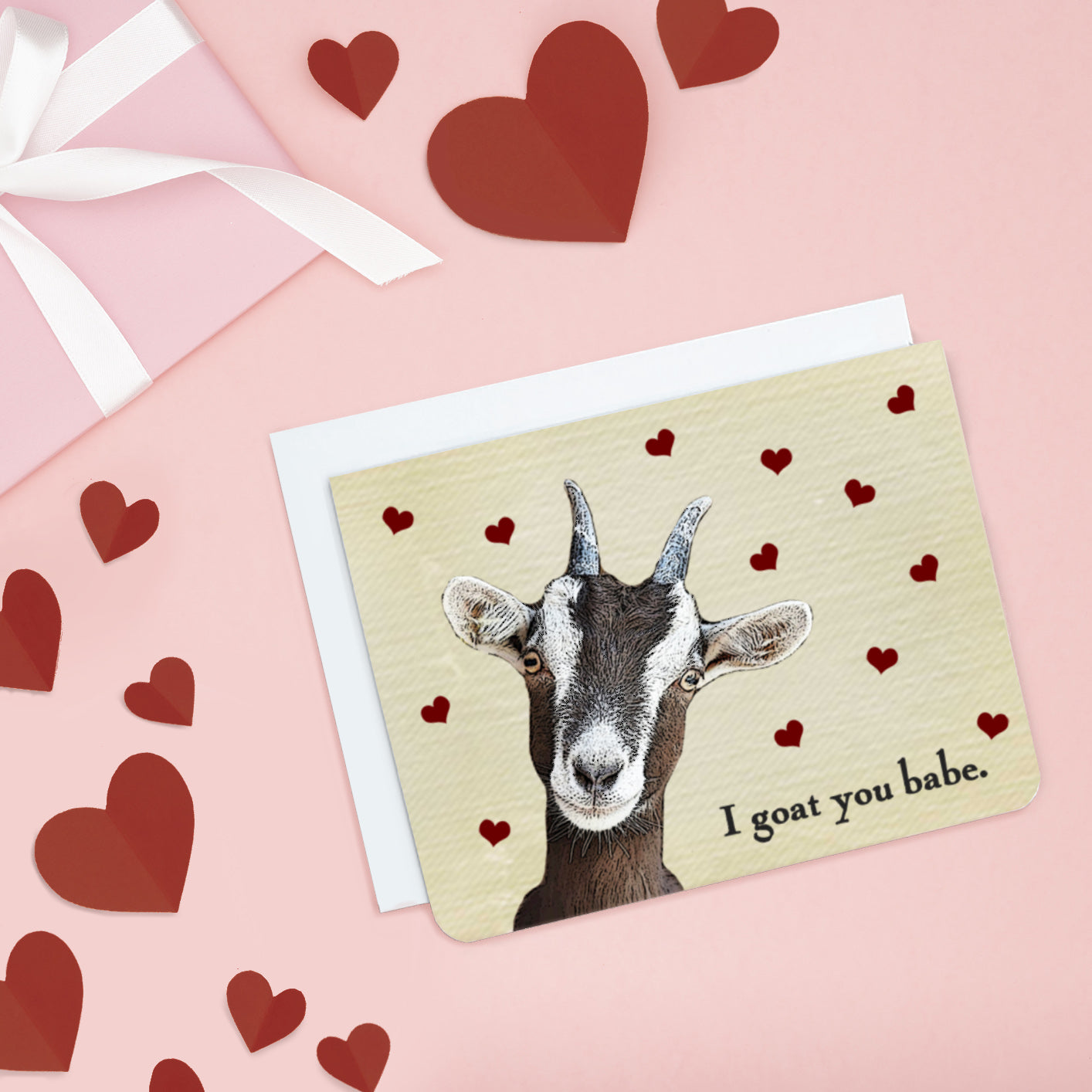 A photo a cute card. It has a cartoon goat on it, text on card says 'I goat you babe.'