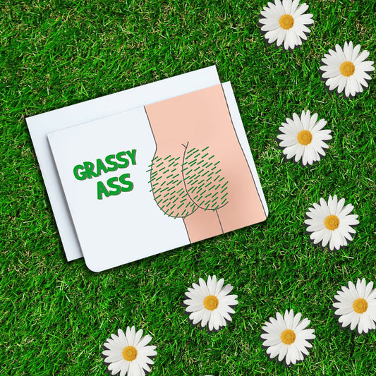 A photo of a thank you card. It has a cartoon bum on it. There's grass growing out of the bum. Text on the card reads, 'Grassy Ass.'