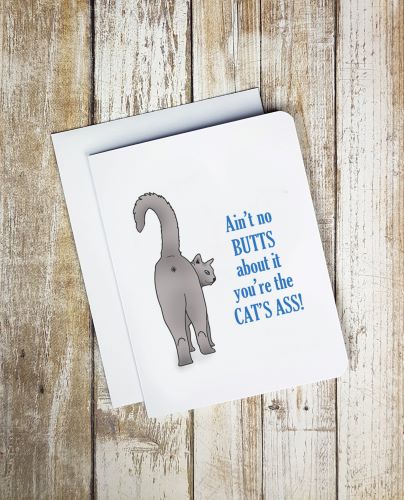 A photo of a white anniversary card. It has a grey cat showing its butt. Text on card reads, 'Ain't no butts about it you're the cat's ass!'