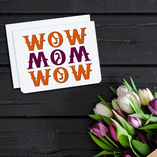 A photo of a Mother's Day card. It reads 'wow mom wow.' in red and orange print.