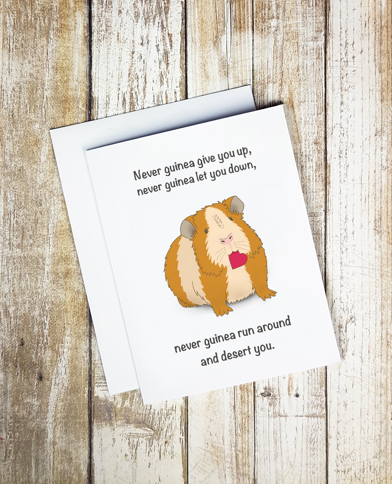 A cute card. It has a cartoon guinea pig on it with a red heart in its mouth. Text on card reads 'Never guinea give you up, never guinea let you down, never guinea run around and desert you.'