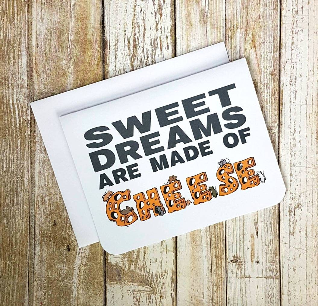 A photo of a greeting card. Text reads, Sweet Dreams are Made of Cheese. The word cheese is in a font that looks like cheese with little mice all over it.