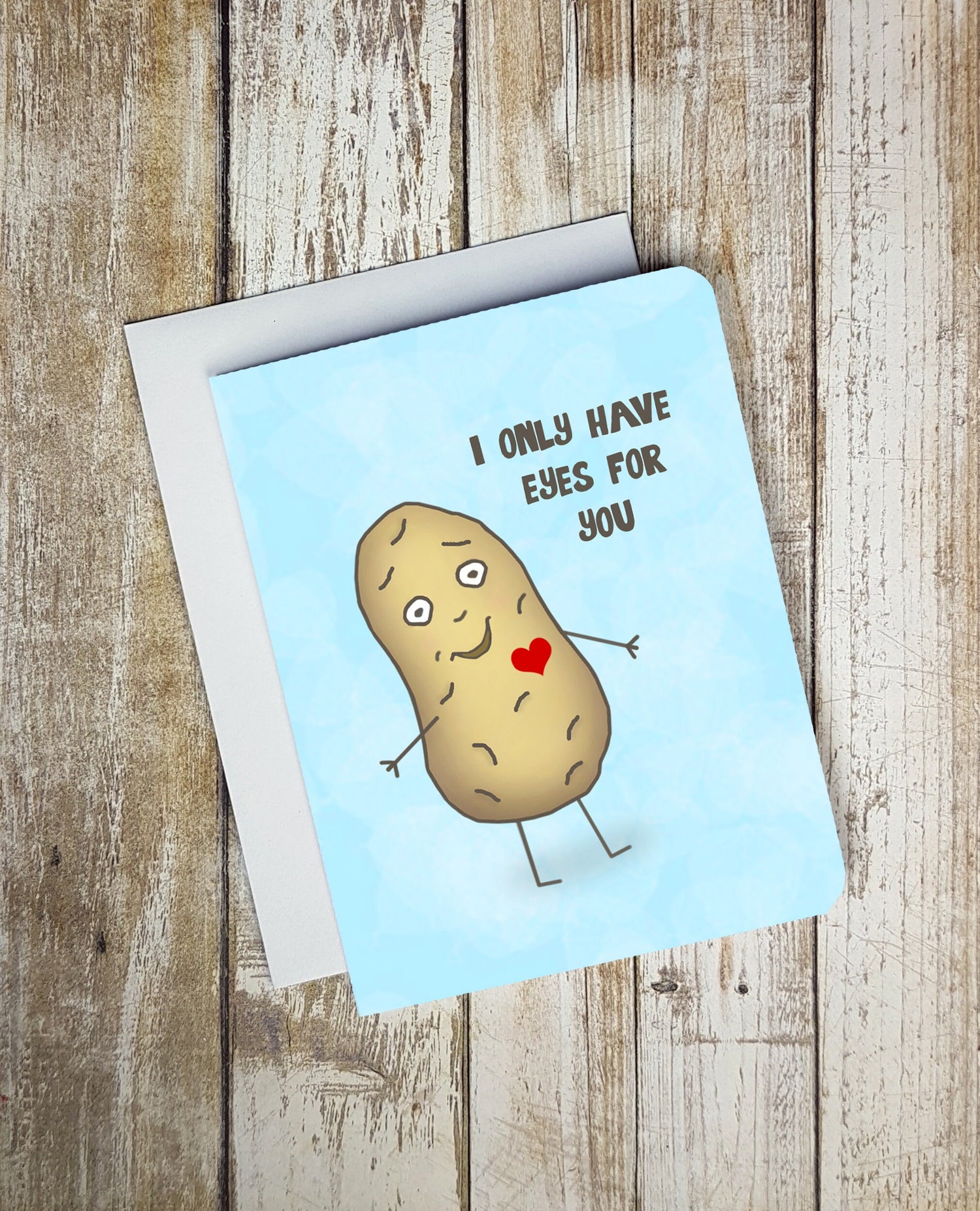 A photo of a smiling cartoon potato. It has a heart on it. Text reads 'I only have eyes for you.'