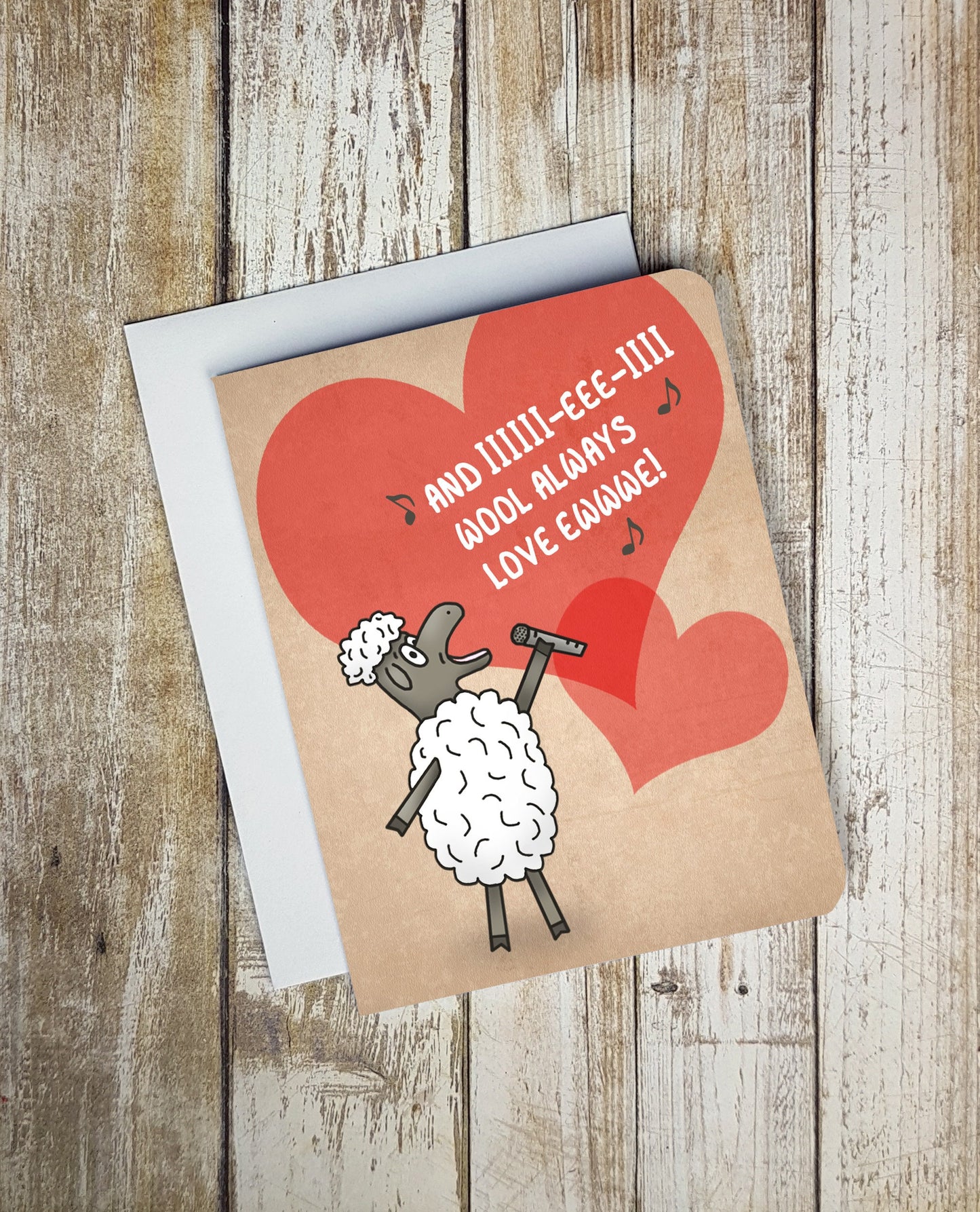 A photo of a valentines card. It has a singing cartoon sheep on it. Text reads, 'And IIIIIII-EEE-IIII wool always love ewwwwwwe!'