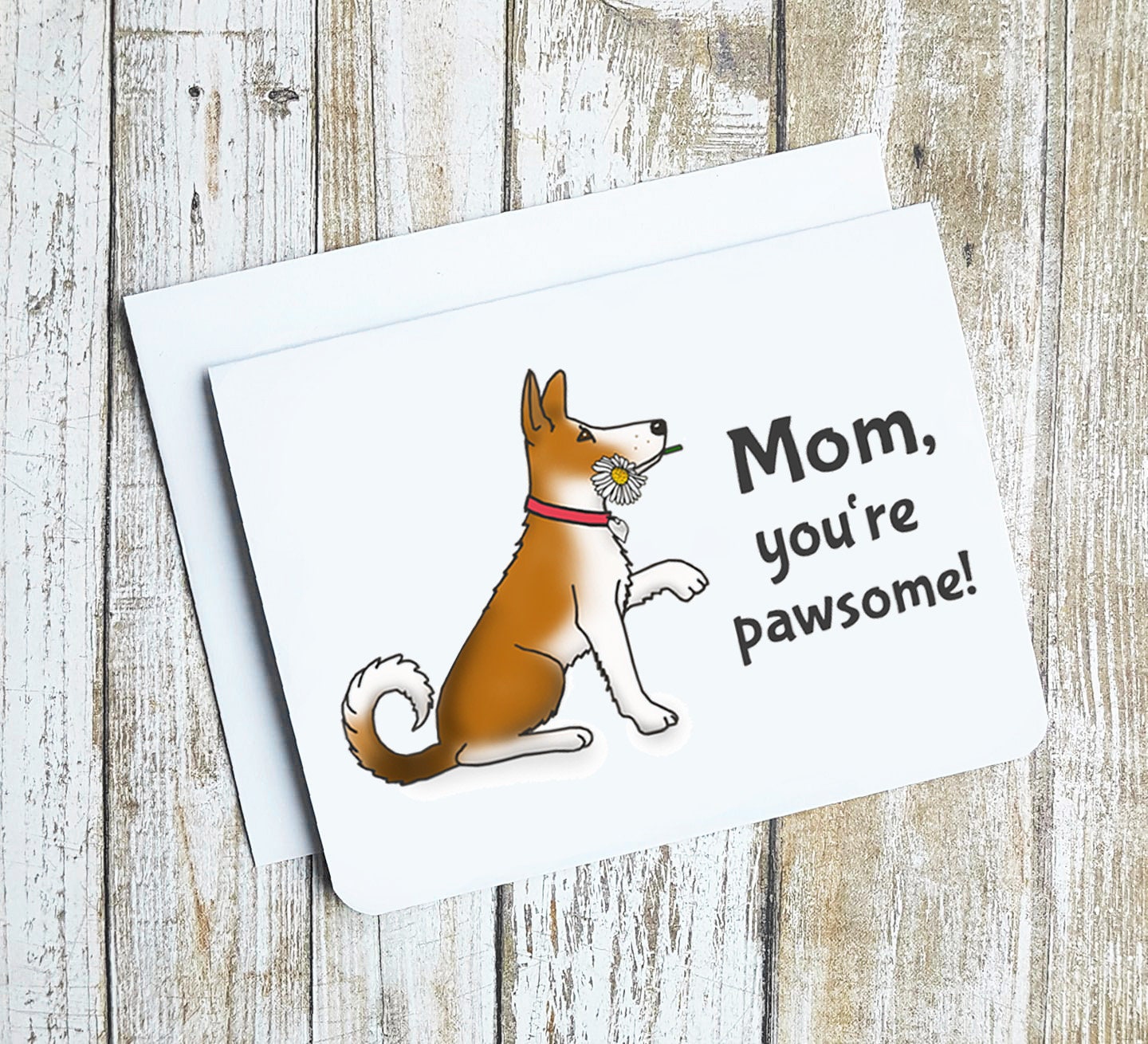 A photo of a Mothers day card. It has dog giving a paw with a flower in its mouth. Text reads, Mom, you're Pawsome!