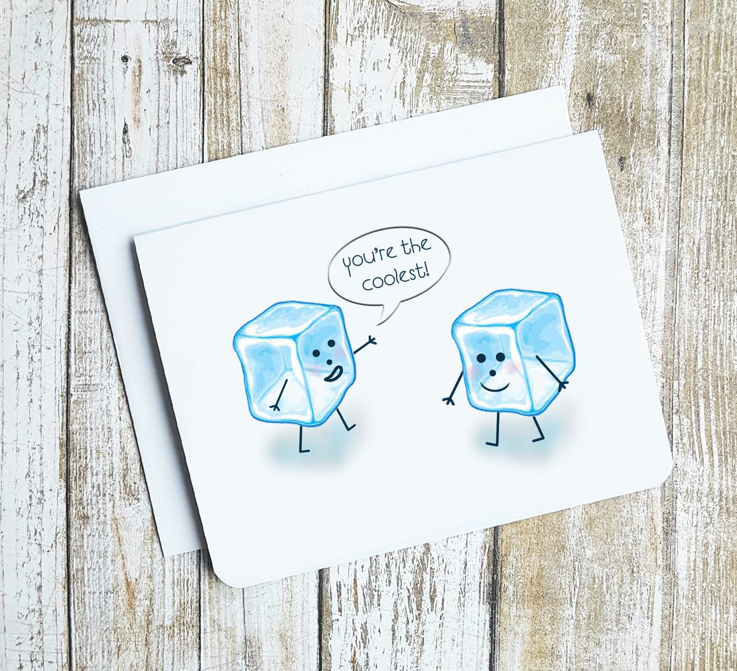A photo of a cute greeting card. It has two cartoon ice cubes on it smiling at one another. One is saying 'You're the Coolest.' 